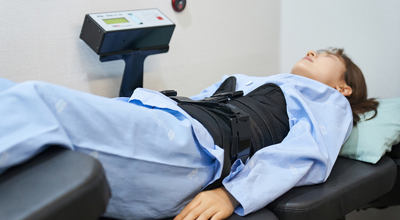 Patient receiving non-surgical spine treatment